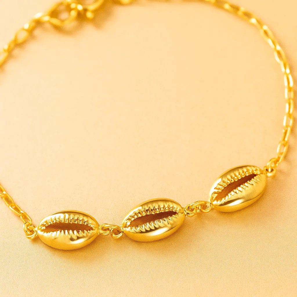 acessorio-feminino-dourado-estilo-praiano-com-buzios