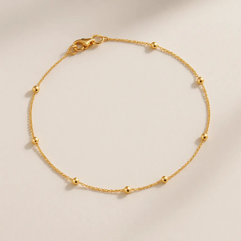 close-tornozeleira-com-bolinhas-douradas-acabamento-fino-zarelle