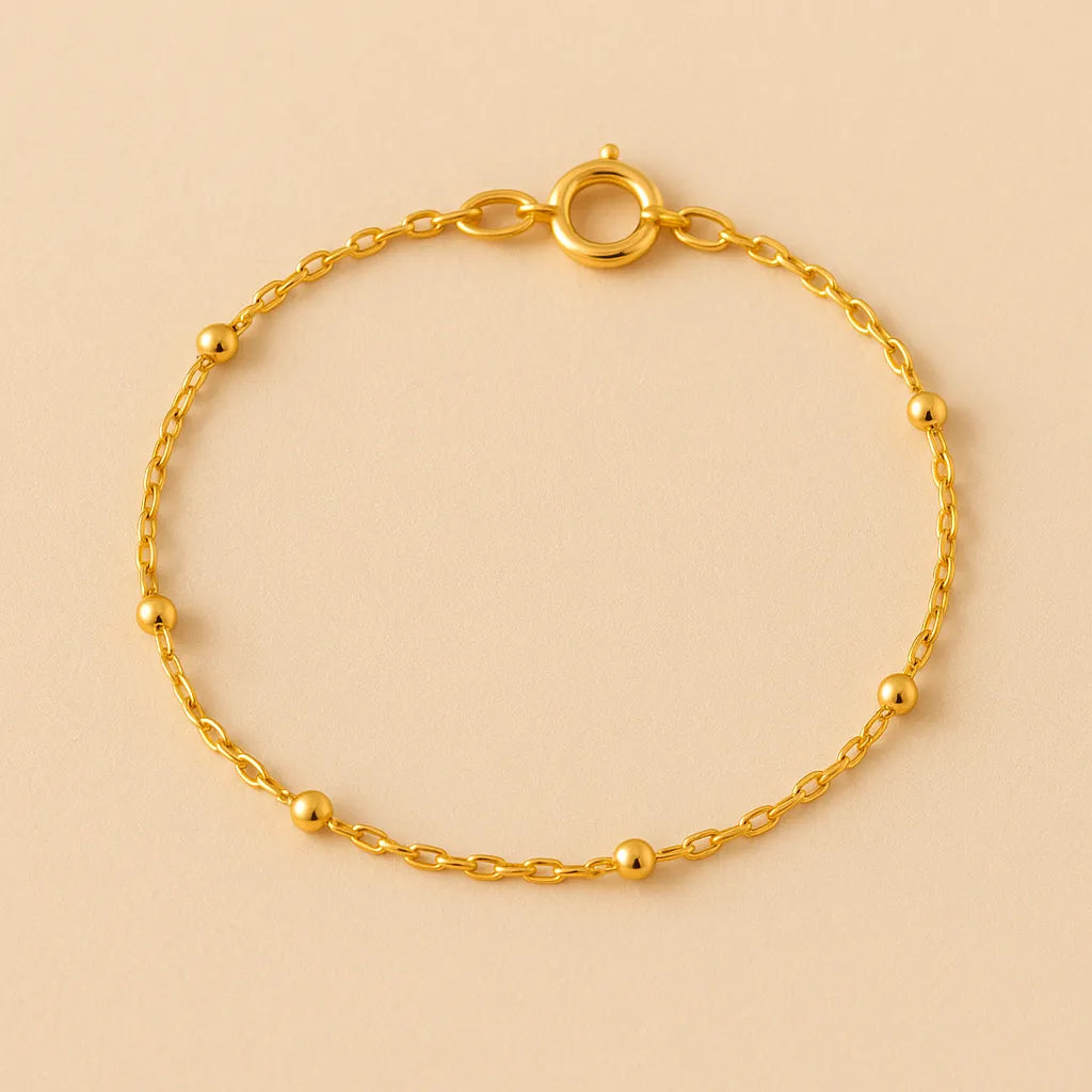 detalhe-pulseira-dourada-bolinhas-banho-ouro-24k-zarelle