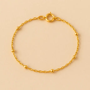 detalhe-pulseira-dourada-bolinhas-banho-ouro-24k-zarelle